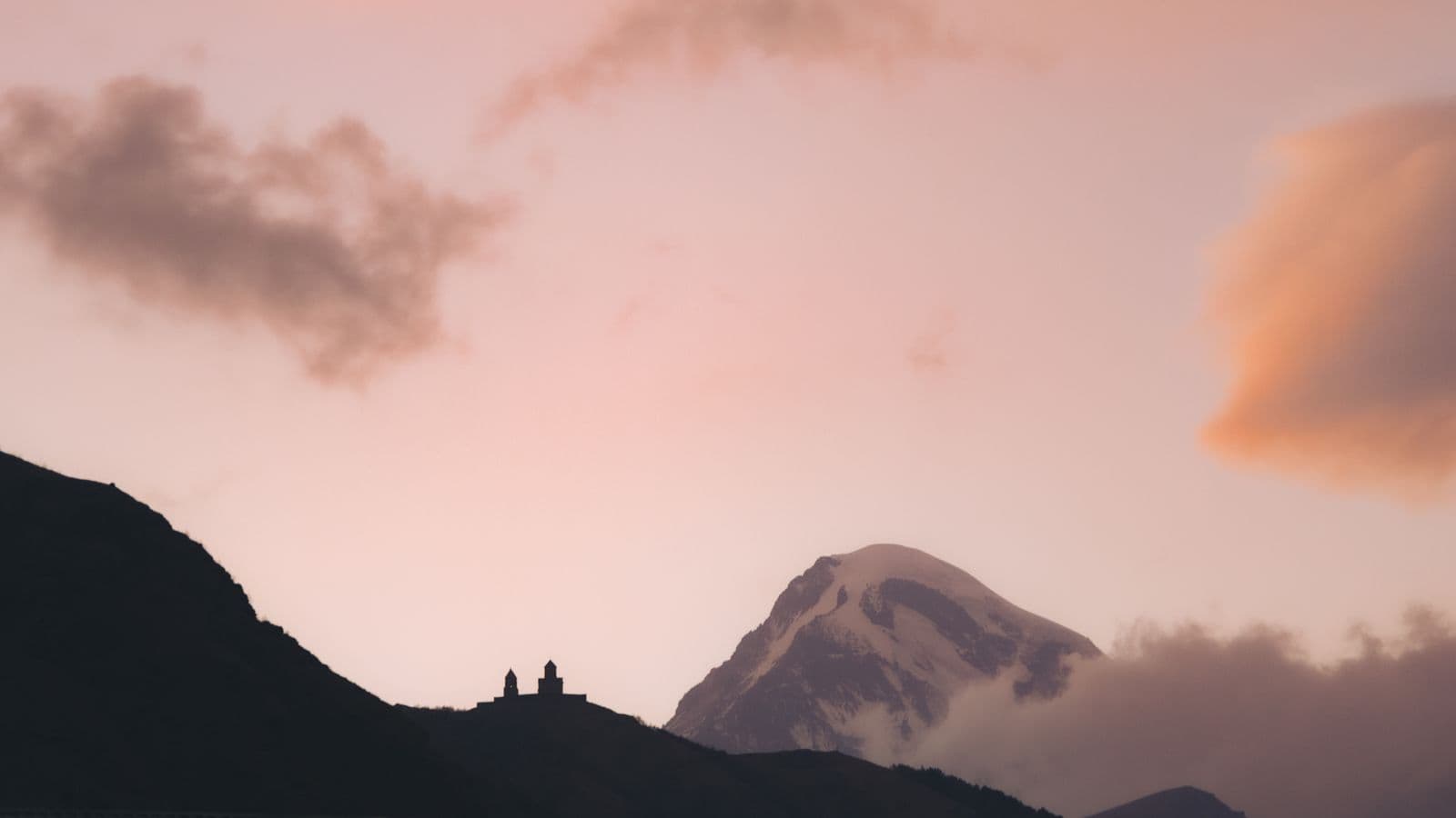 Sunrise over Gergeti Trinity Church and Mount Kazbek